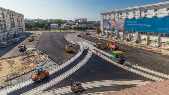 Asphalt Paver, Roller and Truck on the Road Repair Site During Asphalting Timelapse. Road