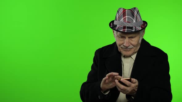 Elderly Grandfather Man Using Smartphone, Pointing at Something with Hand