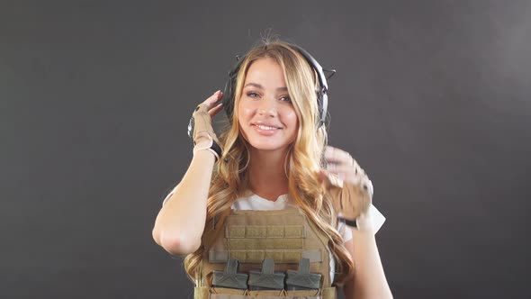 Blonde Female Soldier Dressed in Plate Carrier and Warbelt. Women, Army Concept