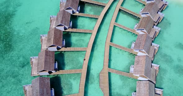 Daytime aerial island view of a summer white paradise sand beach and turquoise sea background in col