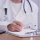 Doctor Video Footage - A Doctor Writing On A Paper - VideoHive Item for Sale