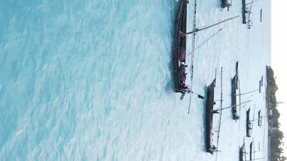 Tanzania Vertical Video  Boat Boats in the Ocean Near the Coast of Zanzibar Aerial View