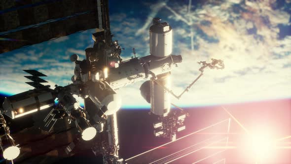 View of the Earth and International Space Station is Orbiting the Earth alt