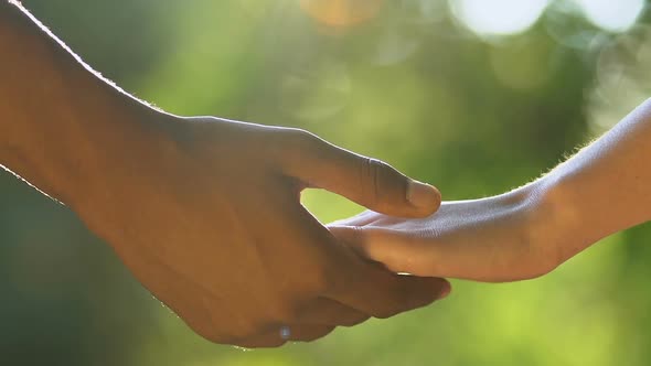 Male Hand Stroking Female Arm to Comfort Friend, Expressing Condolences in Grief