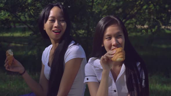 Woman with Smile on Young Face Gossip and Drinking Coffee