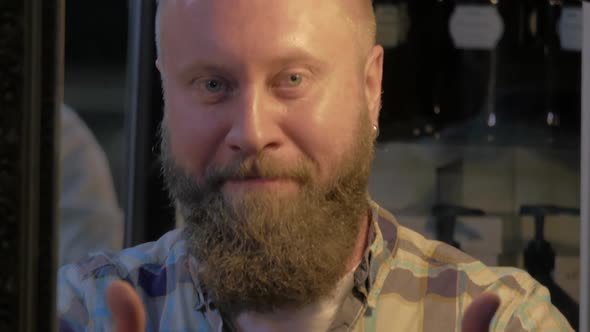 View of Bearded Bald Man Smiling and Showing Thumbs Up