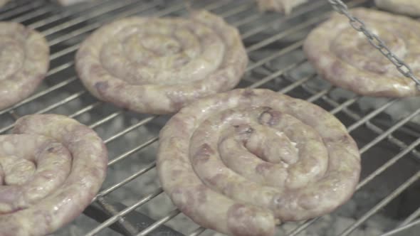 The Meat Is Fried on an Iron Grill. Close-up. B-B-Q.