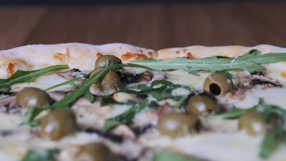 Appetizing Pizza on a Wooden Table in a Restaurant