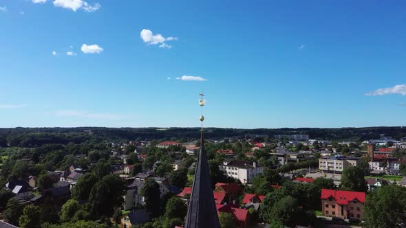  Holy Trinity Lutheran Church in Tukums, Latvia. Golden Cock Statue on the Top of Tower. 4K Video