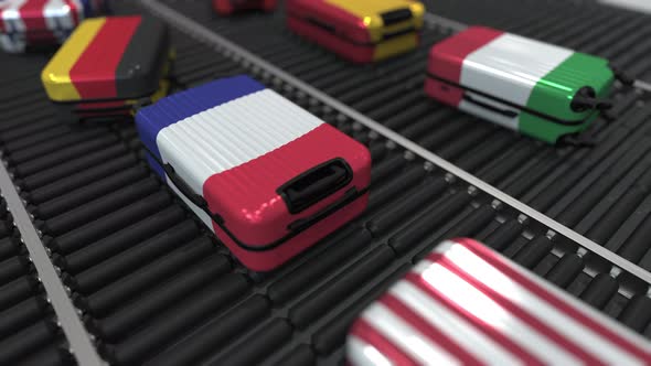 Suitcases with State Flags Move on Conveyor