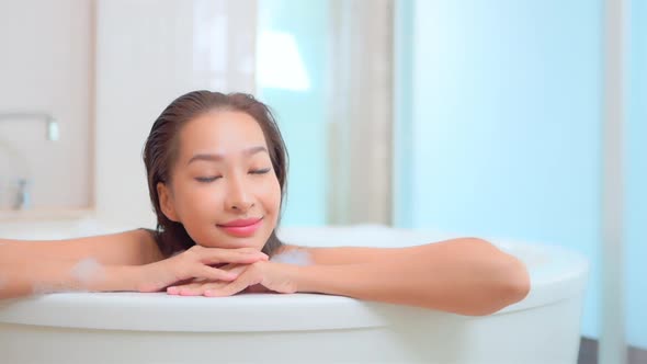 Young asian woman relax in bathtub