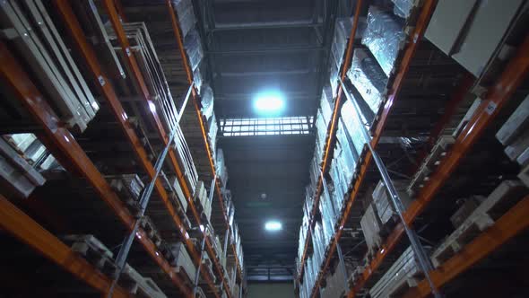 Warehouse with Cardboard Boxes Inside on Pallets Racks Logistic Center