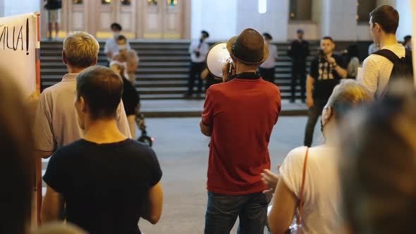 Political Rally Campaign with Bullhorns and Megaphones on Peaceful City Streets