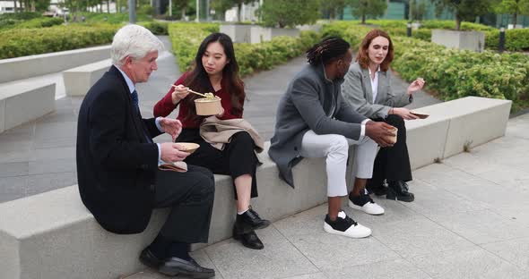 Multiethnic business people doing lunch break outdoor