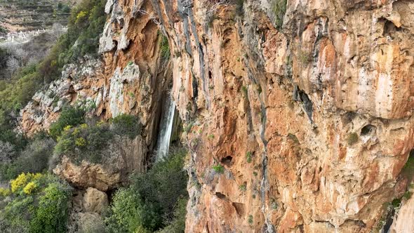 Waterfall in the mountains aerial view 4 K