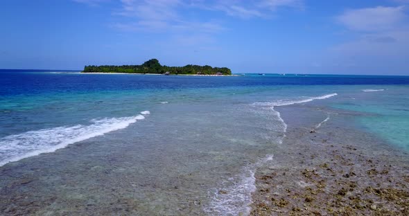 Natural above island view of a summer white paradise sand beach and aqua blue water background in hi