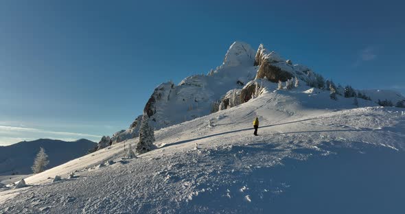 Fly Over and Around the Mountains of Ciucas Romania in January 2022 Sunny Day