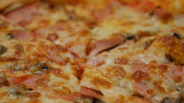 Detailed Italian pizza surface tasty junk food 4K 2160p 30fps UltraHD tilting footage - Slow tilt ov