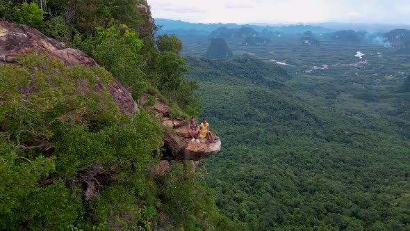 Dragon Crest Rock in the Jungle of Krabi Thailand Couple Men and Woman Looking Out Over Jungle