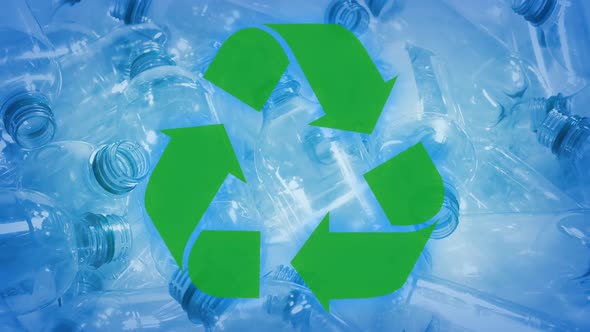 Recycle Symbol With Pile Of Plastic Bottles At Plant