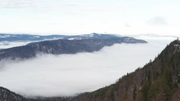 Aerial of beautiful valley seen above the clouds