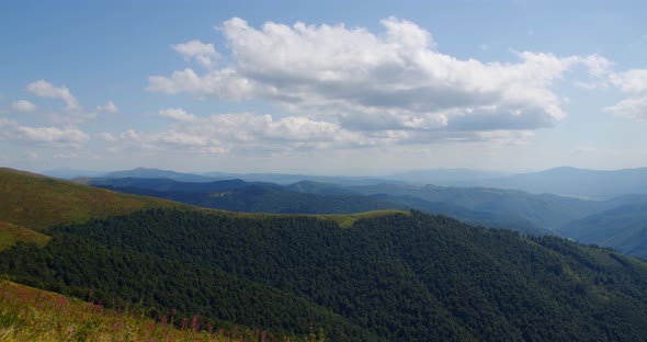 Clouds Floating Over The High Mountains That Cover The Forest