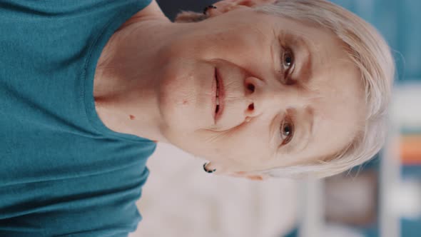 Vertical Video Handheld Shot of Pensioner Doing Workout Exercise