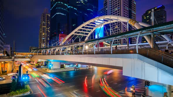 day to night Time-lapse of public sky walk and traffic at Chong Nonsi sky train station, Bangkok