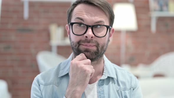 Portrait of Beard Young Man Thinking About Creative Idea