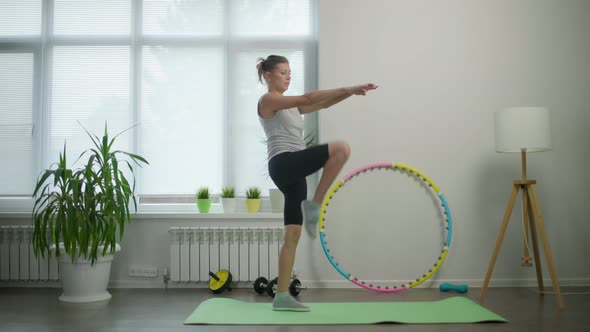 Woman Housewife Doing Fitness Exercises For Her Health