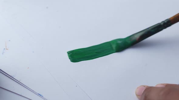 Art Brush with Green Color on a Paper