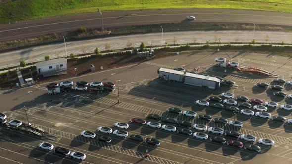 Aerial of Loading Dock at Parking Lot Electric Vehicles Factory Ecofriendly