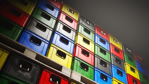 Loop of countless colorful beer crates stacked in a warehouse during night 4KHD