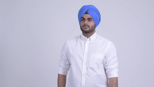 Young Bearded Indian Sikh Man with Turban Thinking