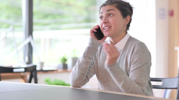 Aggressive Indian Woman Talking on Smartphone 