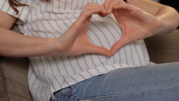 Pregnant Woman Showing Hand Heart Gesture