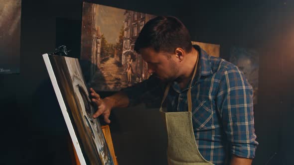 Talanted Artist Using His Hands to Creat an Oil Painting Picture in Art Studio