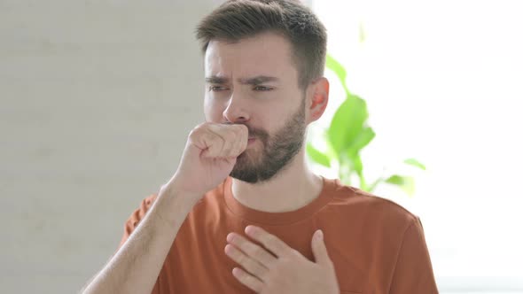 Young Man Coughing and Feeling Unwell