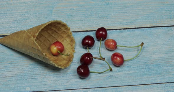 Berry Ice Cream. Berries of Cherry in a Waffle on a Blue Wooden Background