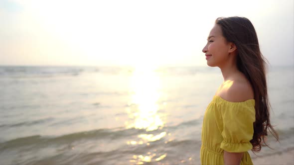 Asian woman enjoy around beautiful beach sea ocean