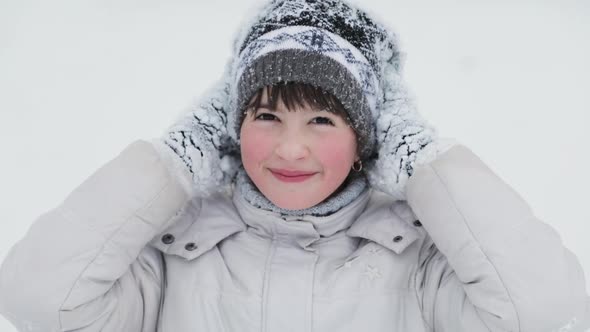 Portrait of Kid Girl in Snowy Park