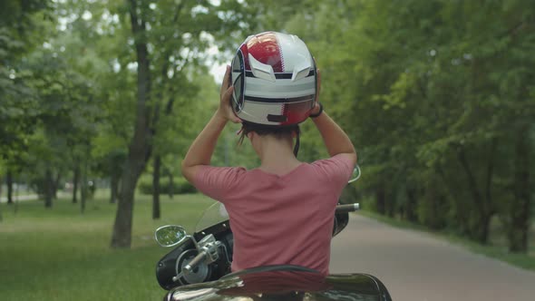 Pretty Blond Girl Enjoying Motorbike Ride Outdoor