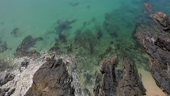 Drone footage of beautiful beach and clear turquoise water. Koh Lantta, Thailand. Panning down to up