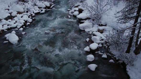 Creek with snow followed downstream