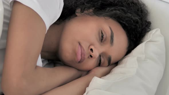 African Woman Thinking While Lying in Bed