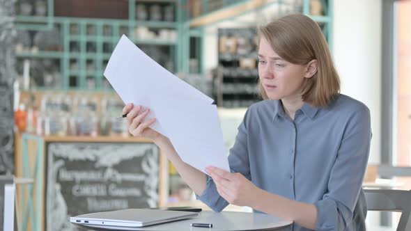 Young Woman Upset By Loss on Documents