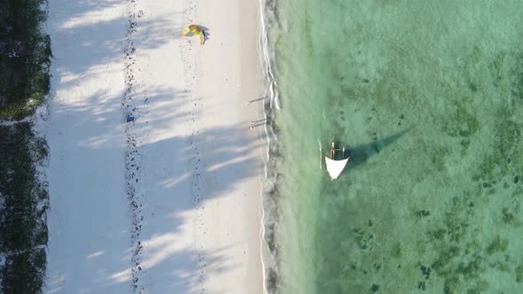 Vertical Video Boats in the Ocean Near the Coast of Zanzibar Tanzania Aerial View