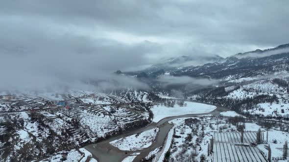 Clouds High in the Winter Mountains Aerial View 4 K