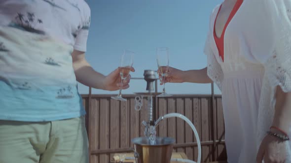 Romantic Couple Takes Champagne Glasses Clinks and Drinks