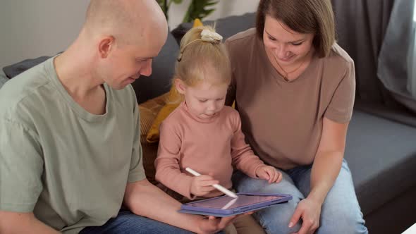 Kid with Cochlear Implants Playing with Tablet Pc at Home